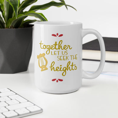 Alpha Chi Omega Together Let Us Seek the Heights White Mug shown in 15 oz size in office with plant