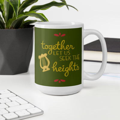 Alpha Chi Omega Together Let Us Seek the Heights Olive Green Mug shown in office environment with handle on right