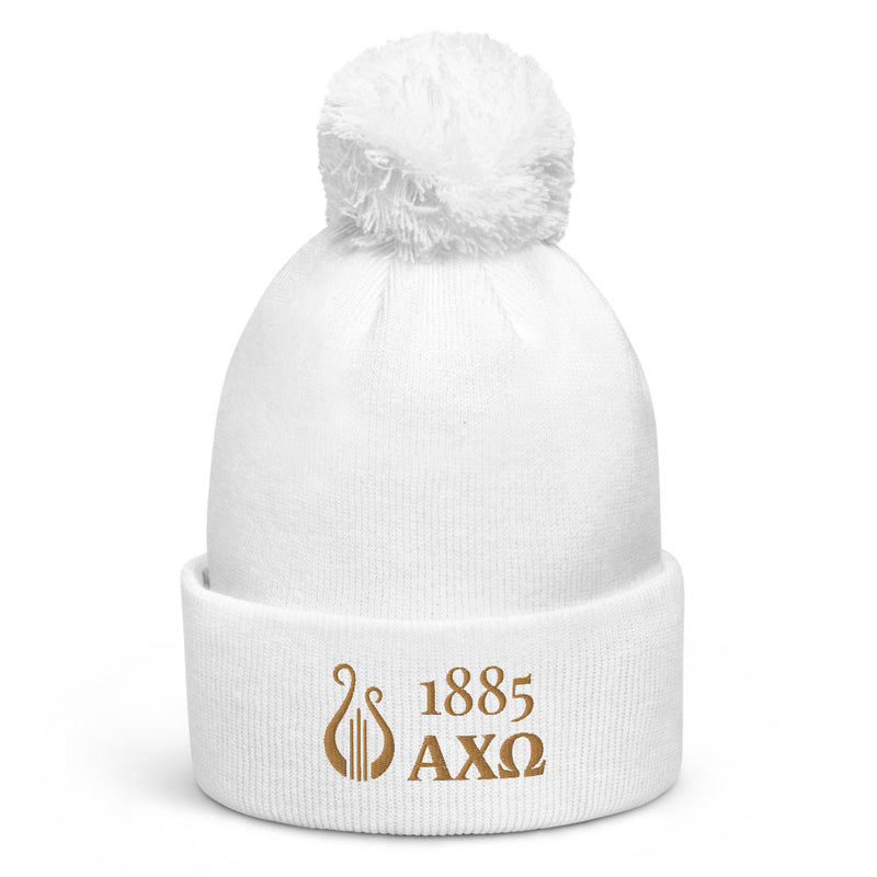 Alpha Chi Omega 1885 Lyre Pom Pom Beanie shown in white with gold
