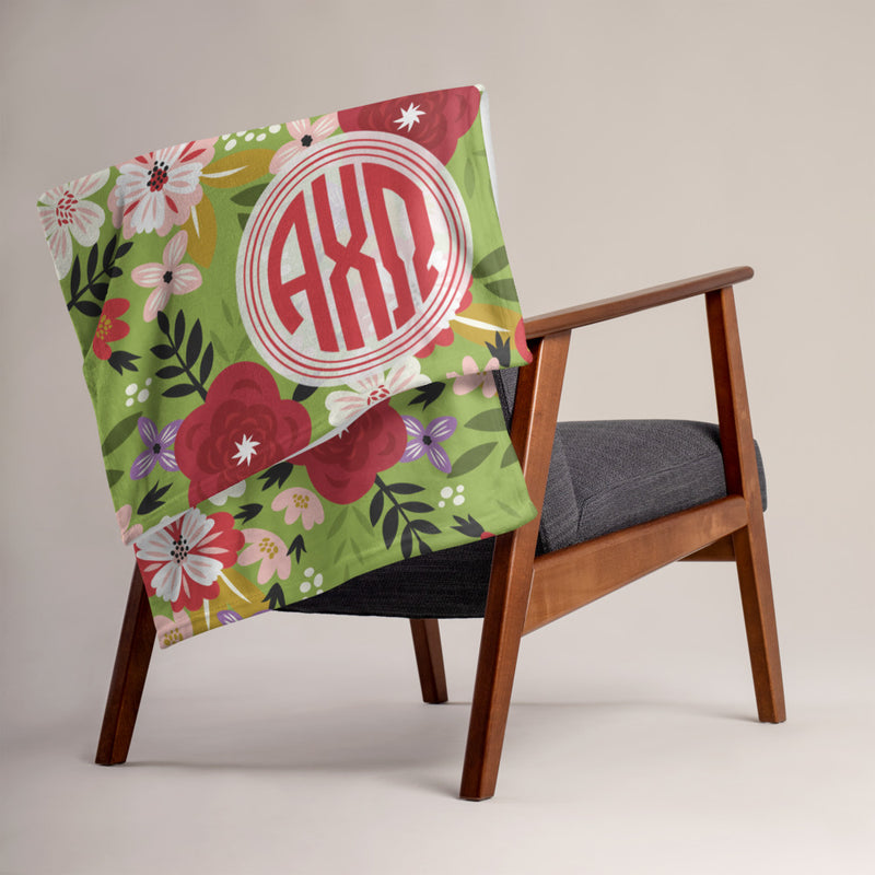 Alpha Chi Omega Modern Floral Greencastle Throw Blanket shown over a chair