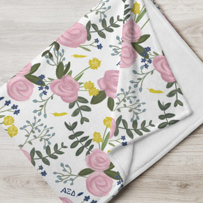 Alpha Xi Delta Pink Rose Throw Blanket, White shown folded and showing white reverse side