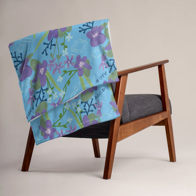Alpha Delta Pi Violet Floral Print Blanket, Blue shown over chair