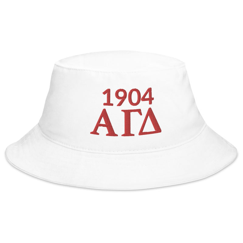 Alpha Gamma Delta 1904 Founding Date Bucket Hat shown in white in full viewomes in white, black or navy with red embroidery.