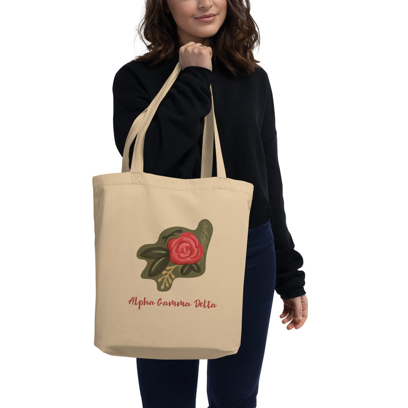 Alpha Gamma Delta Rose Design Eco Tote Bag shown in natural oyster color on model&