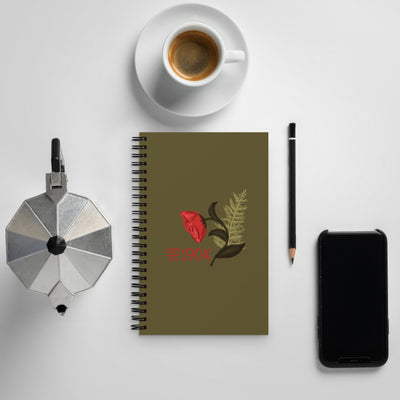 Alpha Gamma Delta 1904 Founding Year Spiral Notebook shown with coffee