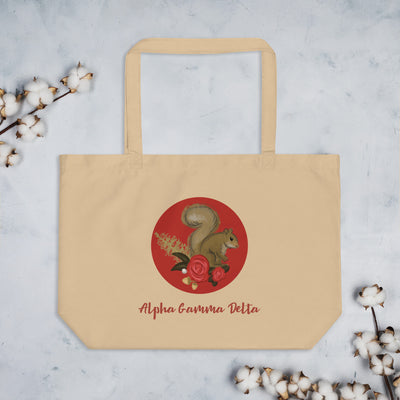 Alpha Gamma Delta Squirrel Large Organic Tote Bag in natural oyster color shown flat with cotton blossoms