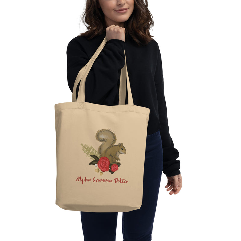Alpha Gamma Delta Squirrel Eco Tote Bag in natural oyster on model&