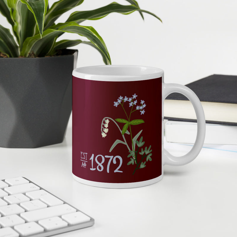 Our Alpha Phi 1872 artisan-created mug featuring the Lily of the Valley flower.