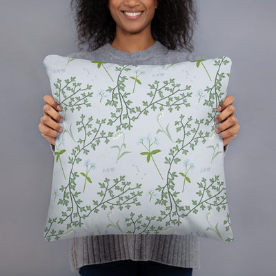 Alpha Phi Lily of the Valley and Ivy Silver Pillow shown in model's hands