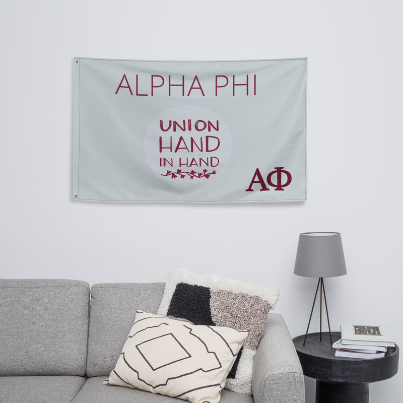 Alpha Phi Union Hand in Hand Flag, Silver and Bordeaux shown in living room