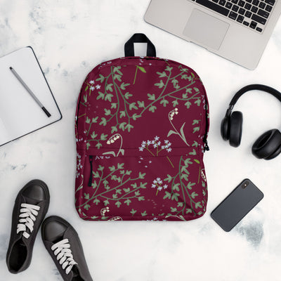 Alpha Phi Lily of the Valley and Ivy leaf print backpack shown in office setting