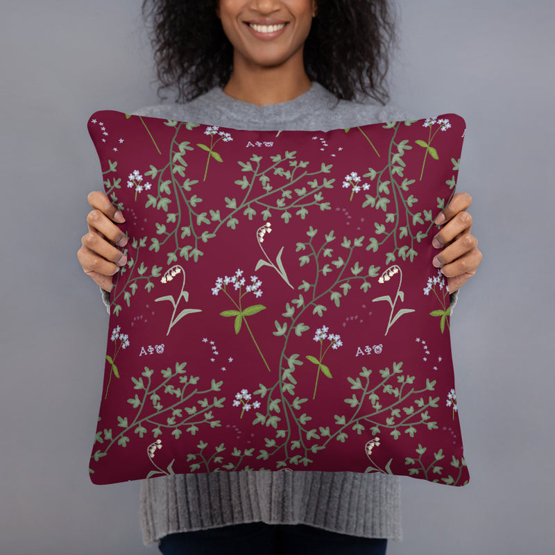 Reverse side of Alpha Phi 1872 Reversible Pillow showing floral print in model&