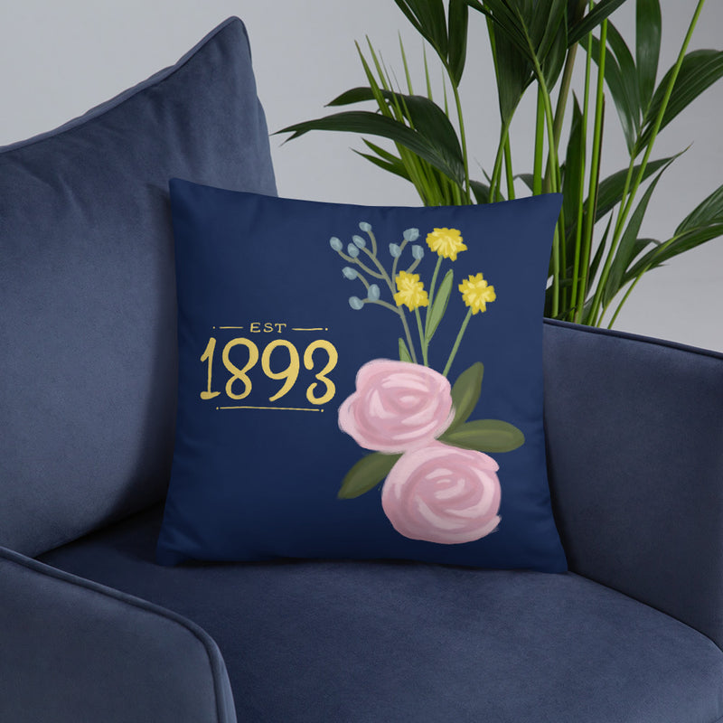 Alpha Xi Delta 1893 Founding Date Pillow shown on blue chair