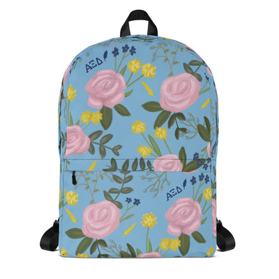 Alpha Xi Delta pink rose floral print backpack blue background.