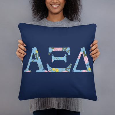 Alpha Xi Delta Greek Letters Navy Blue Pillow held in woman's arms