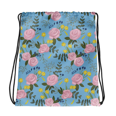 Alpha Xi Delta Floral Drawstring Bag shown flat in light blue