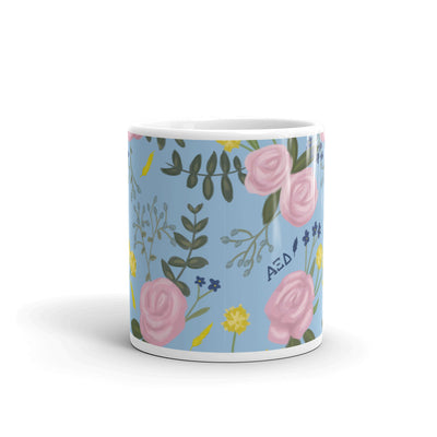 Alpha Xi Delta Floral Pattern Light Blue Glossy Mug in 11 oz size showing print wrapping around mug