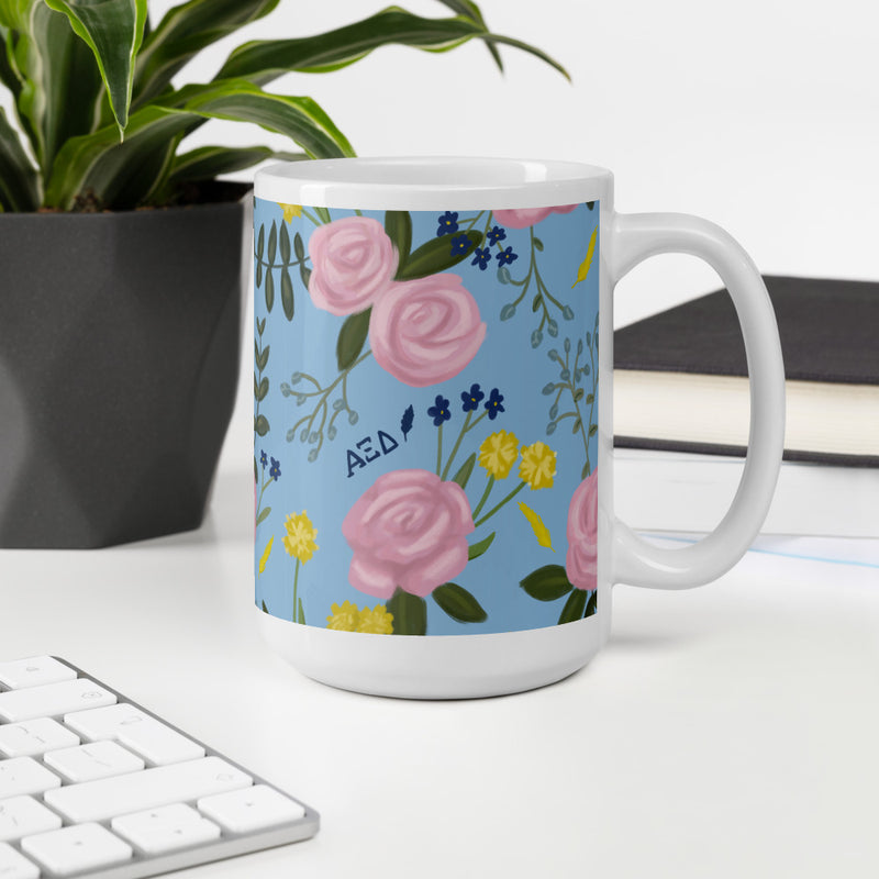 Alpha Xi Delta Floral Pattern Light Blue Glossy Mug  in 15 oz size shown in office