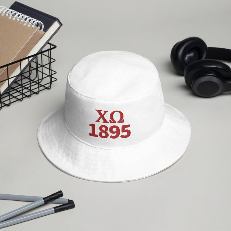 Chi Omega 1895 Founding Date Bucket Hat in white shown in office 