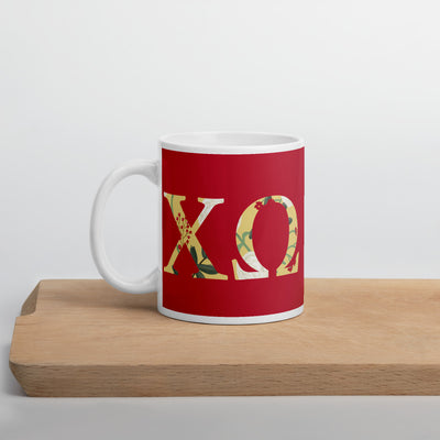 Chi Omega Sorority Letters Mug shown on wood shelf with handle on left