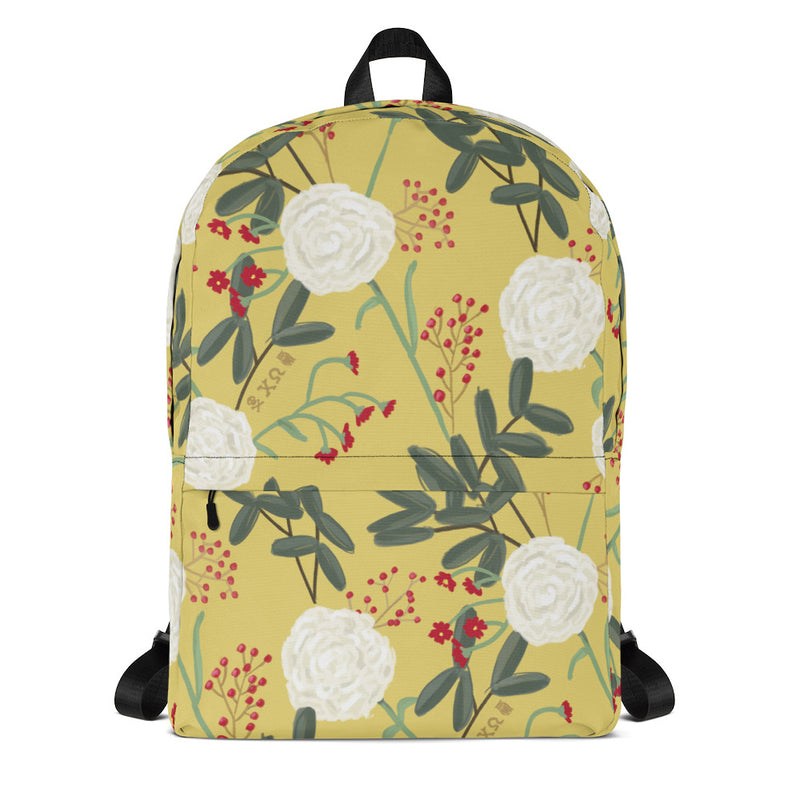 Chi Omega white carnation floral print backpack with straw background shown in front view