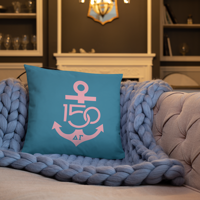 Delta Gamma 150th Anniversary Turquoise and Pink Two-Sided Pillow shown on couch