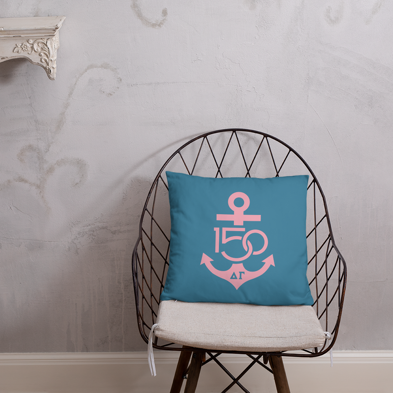 Delta Gamma 150th Anniversary Turquoise and Pink Two-Sided Pillow shown on chair