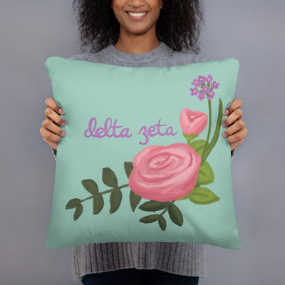 Delta Zeta Pink Rose Light Green Pillow in model's hands