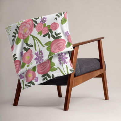 Delta Zeta Pink Rose Floral Throw Blanket shown on a chair