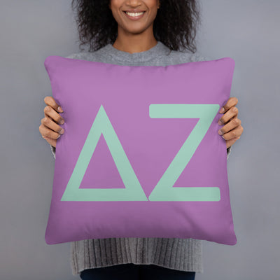 Delta Zeta Greek Letters Purple Pillow in model's hands