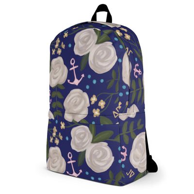 Delta Gamma white rose floral print backpack with a blue background shown in side view