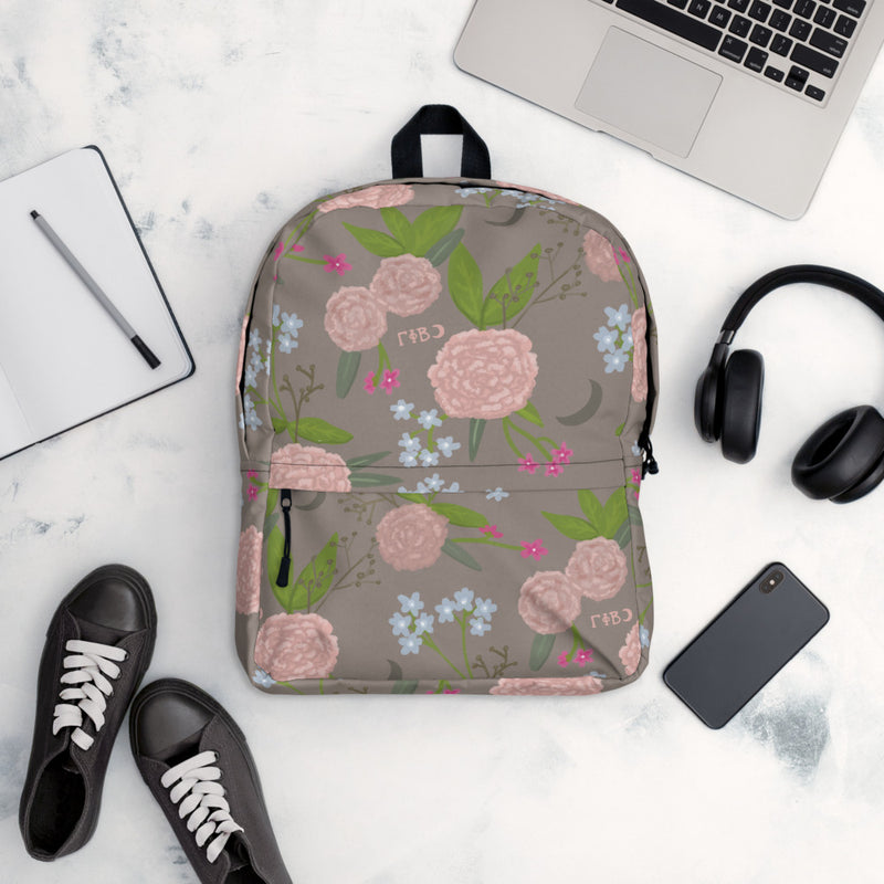 Gamma Phi Beta Pink Carnation Print Backpack shown in office