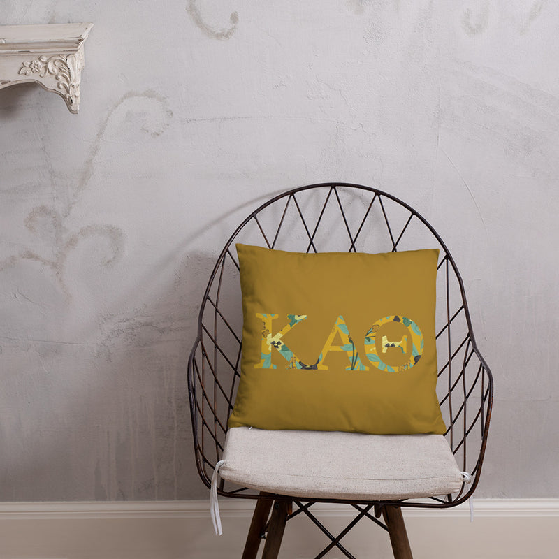 Kappa Alpha Theta Greek Letters Pillow shown on a chair