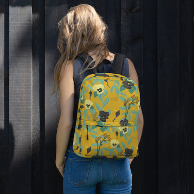 Kappa Alpha Theta black and gold pansy print backpack with a gold background.