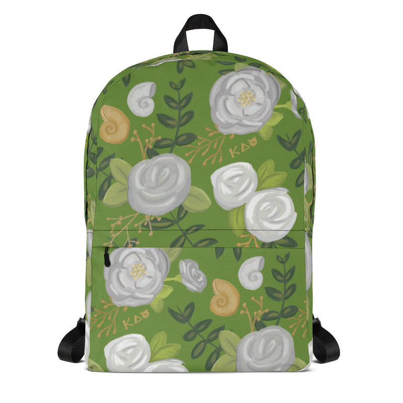 Kappa Delta white rose print backpack with a green background showing front of bag