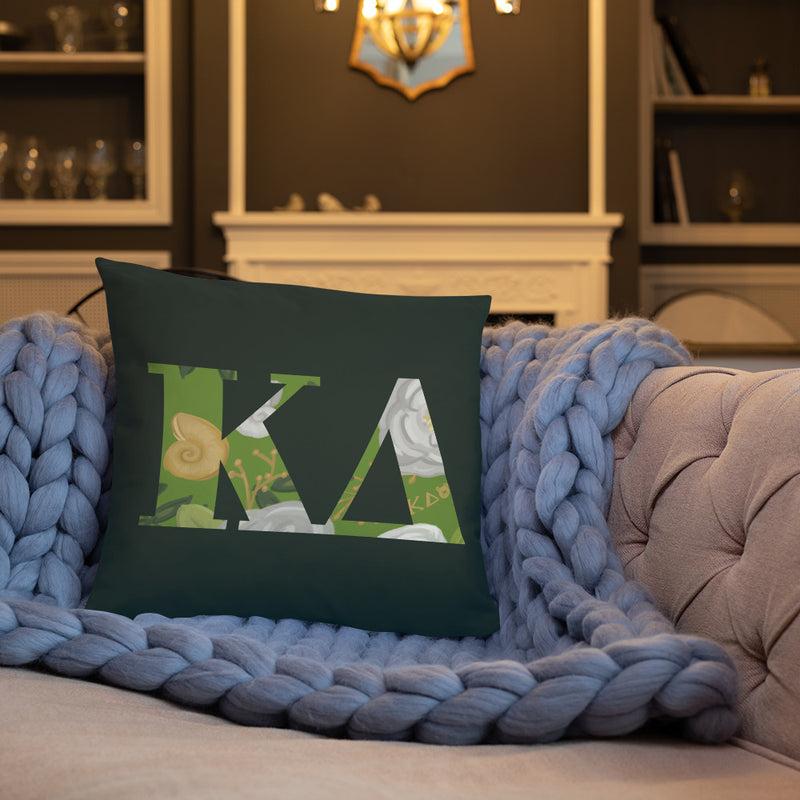 Kappa Delta Greek Letters Dark Green Pillow shown on couch