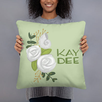 Kappa Delta Kay Dee Light Green Pillow in model's hands