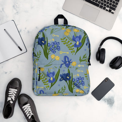 Kappa Kappa gamma iris print backpack with a blue background.