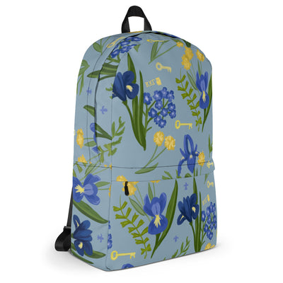 Kappa Kappa gamma iris print backpack with a blue background showing right side view