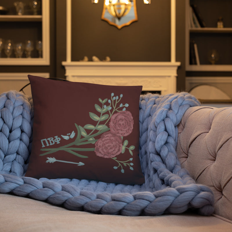Pi Beta Phi Wine Carnation Design Pillow shown on couch