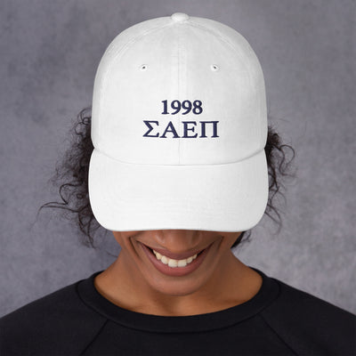 Sigma Alpha Epsilon Pi embroidered baseball hat in white with Navy Blue letters shown on model's head