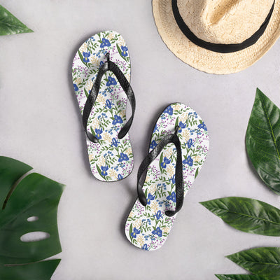 Sigma Alpha Epsilon Pi floral flip flops in top view in lifestyle setting