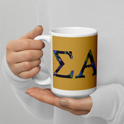 Sigma Alpha Epsilon Pi Letters Mug in 15 oz size shown in model's hands in gold