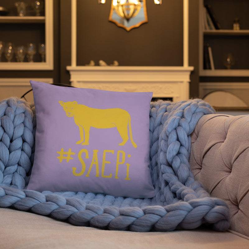 SAEPi Reversible Pillow with Lioness mascot design showing back of pillow on couch