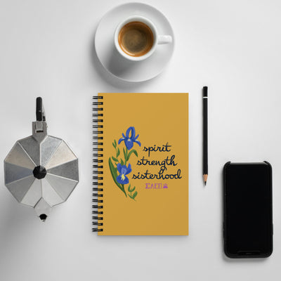 SAEPi motto Spirit Strength Sisterhood Notebook in gold shown in lifestyle setting