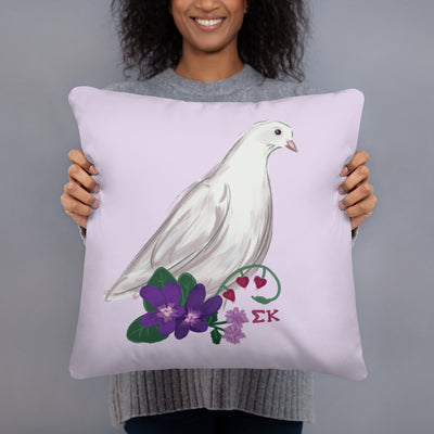Sigma Kappa Dove Mascot Reversible Pillow in lavender in 18" x 18" size in model's hands