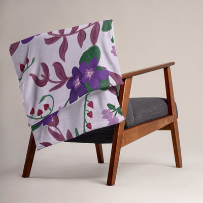 Sigma Kappa Lavender Violet Print Throw Blanket shown on chair