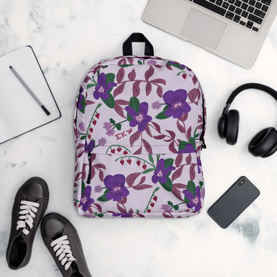 Sigma Kappa violet print backpack with a light purple background in office setting