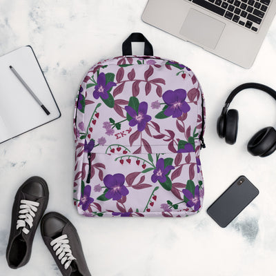 Sigma Kappa violet print backpack with a lavender background in office setting