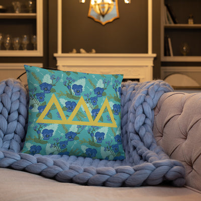 Tri Delta Greek Letters Pillow shown on couch